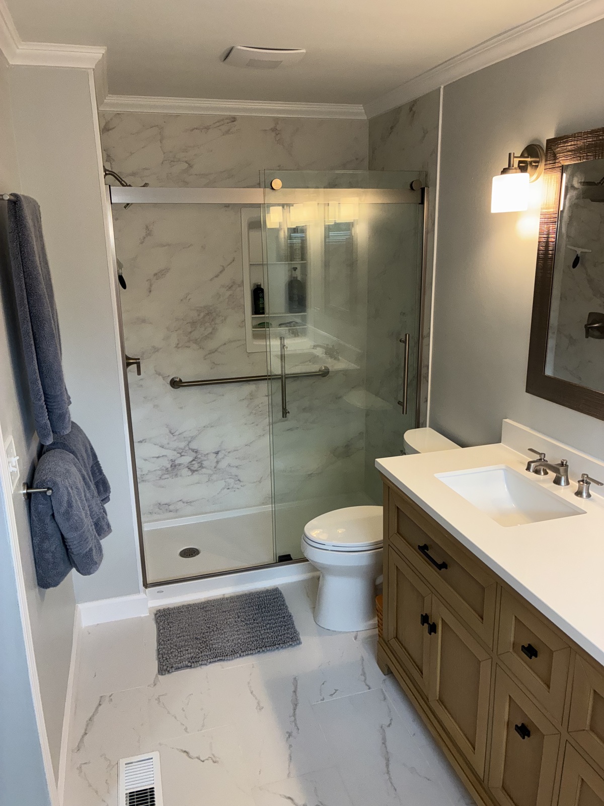 Remodeled bathroom with a glass shower.
